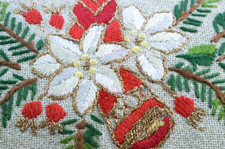 Embroidered multi-colored threads ukrinian Christmas doily closeup, fragment