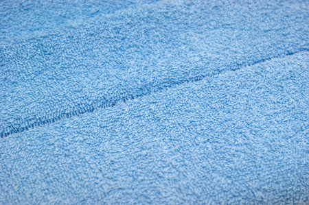 The background of textured blue cotton fabric closeupの写真素材