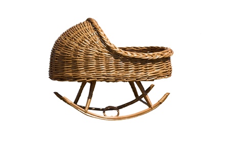 Baby cradle made by weaving willow wine in isolationの写真素材