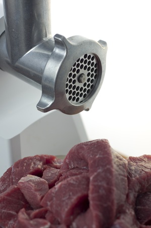  Electric meat grinder and beef on a white background closeupの写真素材