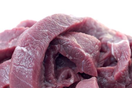 Pieces of fresh beef on a white background closeupの写真素材