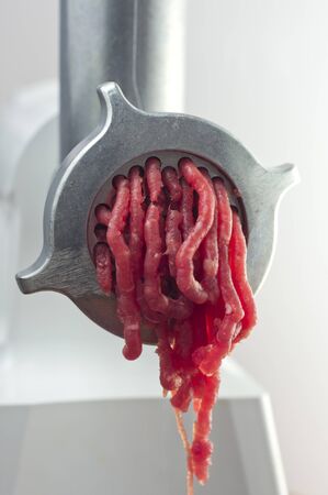 Manufacture of fresh minced meat in closeupの写真素材