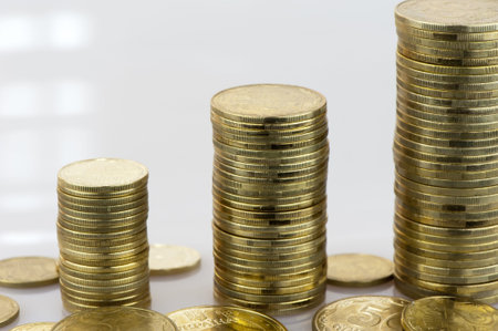 Ukrainian coins stacked in columns in the form of graphics close-up