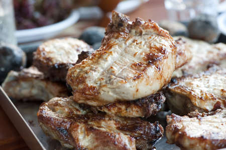 Large pieces of meat roasted on the grillの写真素材