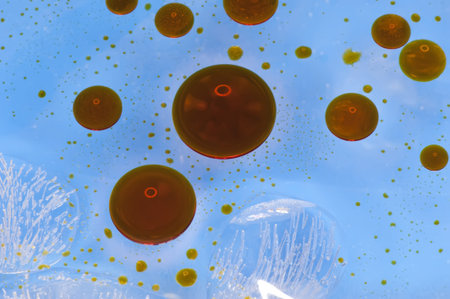 Abstract color background oil generated on the surface of the water, closeup