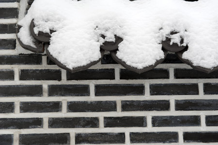 The background of the Korean garden wall with traditional symbolic embellishments