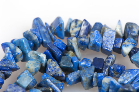 Beads made of blue stone on a white background