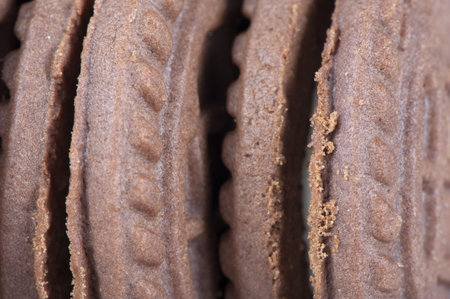 Chocolate cookies with white sugary filling close up