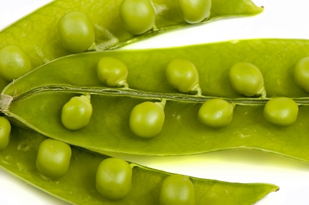 Green peas, legumes close up on a white backgroundの写真素材