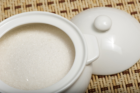 White sugar in the sugar bowl on the tableの写真素材
