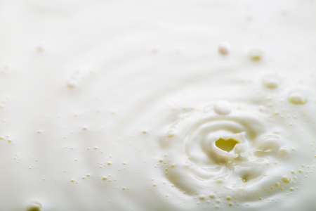  Background of fresh milk, which is poured into a saucerの写真素材