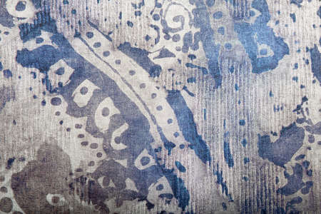 Background of the old fabric with an abstract pattern in purple tonesの写真素材