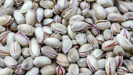 Uncleaned pistachio nuts closeup background