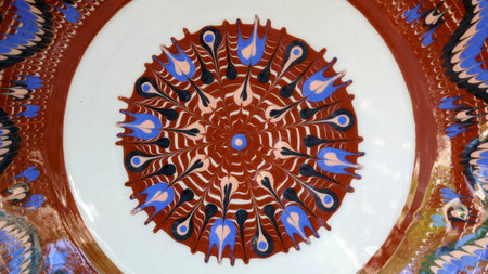 Clay products handmade folk Ukrainian traditional production of dishes, samples of art plates