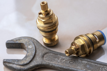 Old wrench and two wrench bridge faucet different designsの写真素材