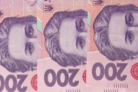 Ukrainian paper banknotes in denominations of two hundred hryvnia close-up macro photo background