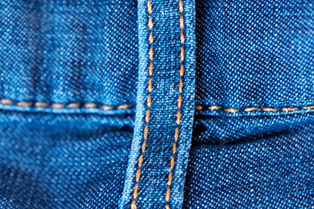 Blue denim background shot with shallow depth of field close-up macro