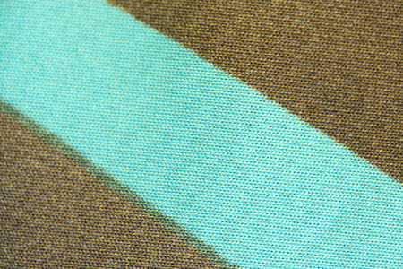 Brown with blue background of knitted machine knitting wool yarn close-up macro shootingの写真素材