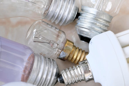 Lighting electric lamps for living rooms LED and incandescent bulbs close-up lie on the table
