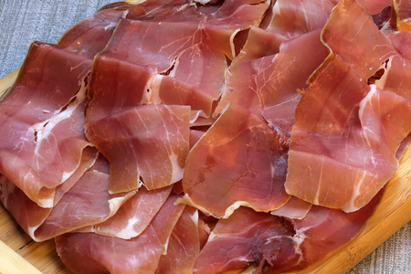 Dried red meat, jamon cut into thin slices close-upの写真素材