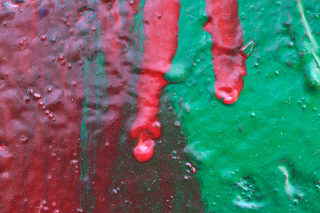 Old painted concrete surface textural background close-up macro photographyの写真素材