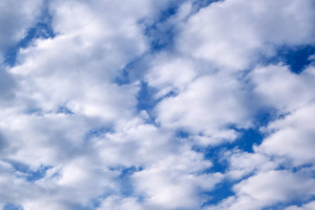 Background of white clouds on a blue sky in a winter cloudy day