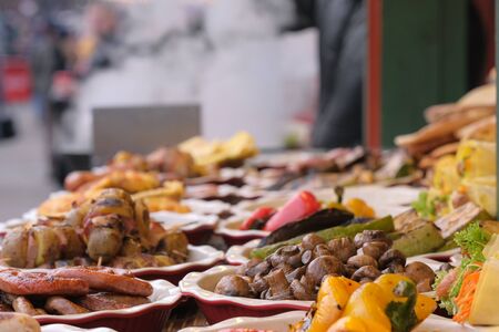 Street trading in Kiev, on January 7, 2020, grilled meat and vegetable snacks at Christmas festivitiesの写真素材