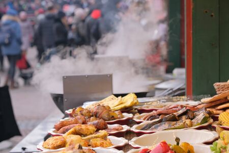 Street trading in Kiev, on January 7, 2020, grilled meat and vegetable snacks at Christmas festivitiesの写真素材