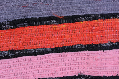 Homespun rug made by hand from colored stripes of fabric