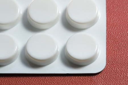 Pills packed in plastic blisters close-up macro photo on the subject of pharmaceuticals and medicine
