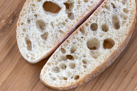 Food background macro photo sliced white wheat bread sliced on a cutting board