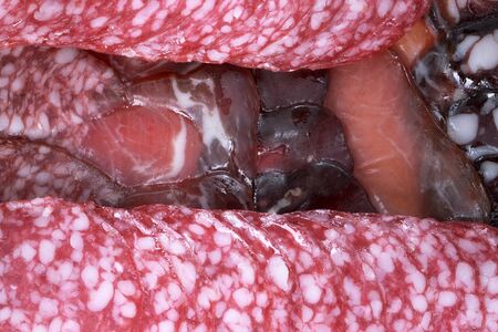 Meat food background from assorted dried sausages of different varieties illustration of meat products close-up macro photographyの写真素材