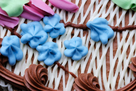 Beautiful flower decoration butter cream sweet cake with nuts close-up macro photography