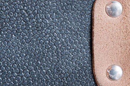 Textured leather background from fragments of an old shabby used navigator's briefcase close-up macro photographyの写真素材
