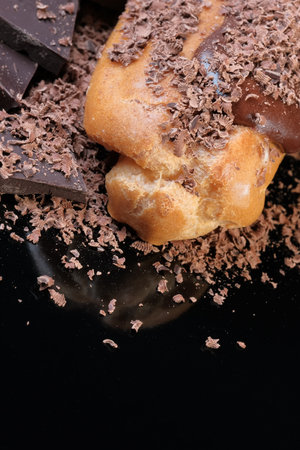 Custard cake sprinkled with dark chocolate shavings close-up macro photography