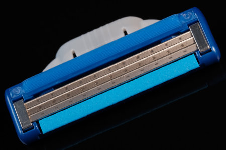 Colored composition on black mirrored background with clothespins close-up macro photography
