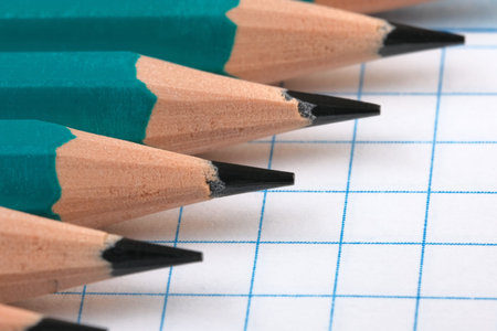 Symbolic illustration of office, scientific work and education simple pencils on an open notebook...