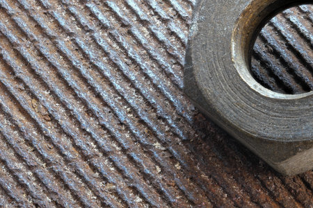Artistic picture with rusty iron old bolt on rusty iron surface close-up macro photography