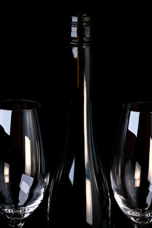 Red fortified wine is poured into a glass goblet art photography on a black background close-upの写真素材