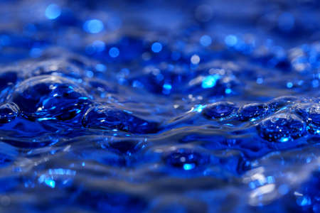 Abstract texture art blue water background with air bubbles close-up macro photographyの写真素材