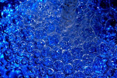 Abstract texture art blue water background with air bubbles close-up macro photography