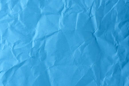 Paper textured background from crumpled blue paper close-up macro photography high detailの写真素材