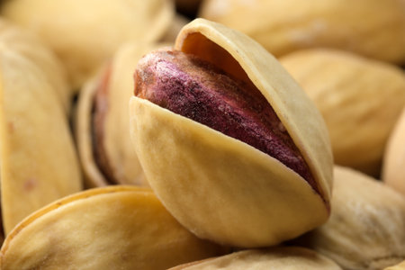 Toasted salted pistachio nuts close-up macro photography