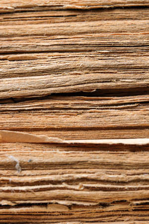 Paper background from the pages of an old yellowed book close-upの写真素材