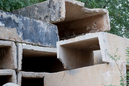 Old building blocks and slabs in a landfill in the city, environmental sketch, nature conservation