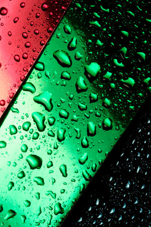 Abstract photography with water drops with reflections on red, green and blue, close-up background, macro photographyの写真素材