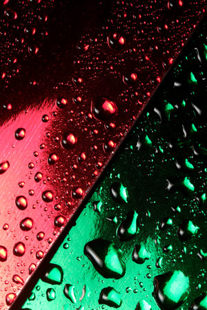 Abstract photography with water drops with reflections on red and green, close-up background, macro photographyの写真素材