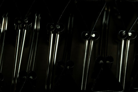 Stationery binder clips on a wooden table, close-upの写真素材