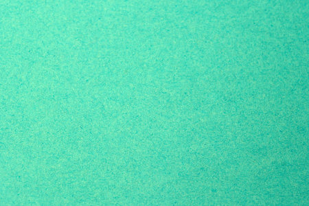 Bright turquoise backdrop provides a perfect canvas for artistic expression and design.