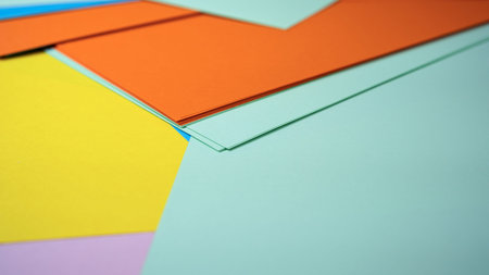 Brightly colored sheets of paper invite creativity and artistic exploration.
